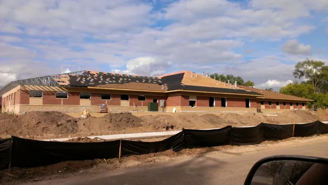 DFC Roofing commercial roofing crew at work on a low-slope roof