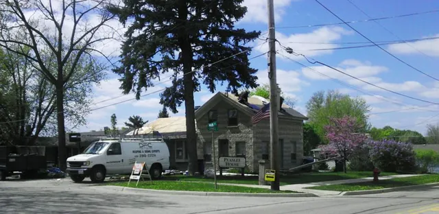 Home exterior with new roof and siding by DFC Roofing
